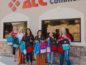 ATC ladies with pack backs for Julie's Clothes for Kids event